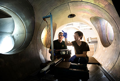 Students working on a plasma vacuum chamber. Links to Gifts by Will